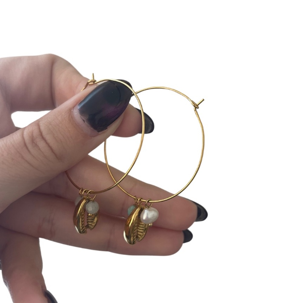 gold earrings with beachy charms